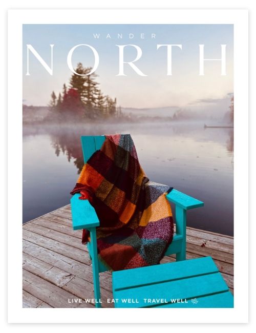 Wander North Fall 2026 cover, featuring an Adirondack chair beside a misty lake
